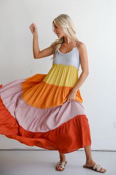 You'll always get compliments on your summer style when you wear the Compelling Aesthetic Color Block Maxi Dress! Crafted from lightweight, flowing fabric, this maxi dress is as comfortable as it is stylish, making it perfect for both casual and semi-formal occasions. This modern twist on traditional color blocking adds a dynamic and eye-catching element to your ensemble. Designed with tiered layers, the maxi dress offers a graceful silhouette that cascades beautifully with each step. The flowin Rust Dresses, Dress Boutiques, Rust Color Dress, Color Block Maxi Dress, Aesthetic Color, Casual Kimono, Flowing Fabric, Rust Dress, Puff Sleeve Dresses