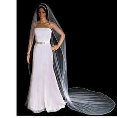 a mannequin wearing a wedding dress and veil