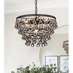 a chandelier hanging over a dining room table