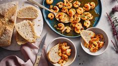 some bread and shrimp are on a table