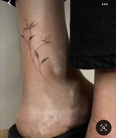 two people with tattoos on their feet and one has a flower tattoo on the ankle