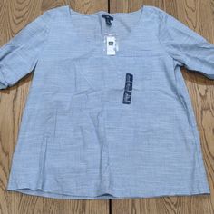 Lightweight Blouse. Blue. Gap Short Sleeve Spring Blouse, Gap Short Sleeve Blouse For Spring, Chic Cotton Blouse By Gap, Gap Cotton Blouse, Chic Gap Blouse For Work, Chic Workwear Blouse From Gap, Chic Gap Tops For Work, Gap Summer Workwear Shirt, Gap Shirt For Summer Workwear