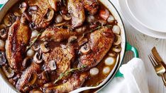 chicken with mushrooms and onions in a skillet