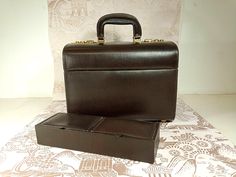 a brown briefcase sitting on top of a table