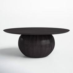 a black table with an oval top on white background