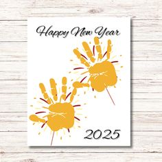 a happy new year card with two hand prints