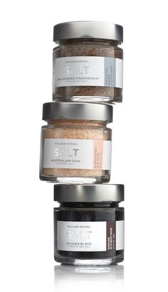 three spice jars stacked on top of each other