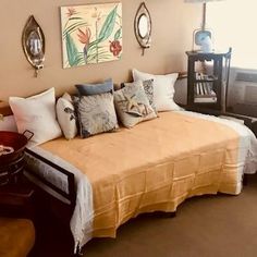 a bed sitting in the middle of a bedroom next to a window