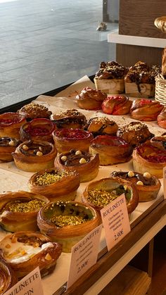 many different types of pies are on display