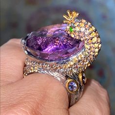 Absolutely Breathtaking And Specially Designed Ring With Genuine Pear Cut 32 Ct Amethyst, Accented With Colorful Genuine Sapphire, Chrome Diopside And Tanzanite! All Stones Are Precious, Beautifully Cut And Carefully Selected Just For This Ring. 925 Sterling Silver, Rhodium And 13 K Yellow Gold Overlay. Endless Magic! An Ethereal Stunner! Purple Diamond Ring, Peacock Ring, Purple Ring, Purple Rings, Gold Overlay, 925 Jewelry, Pear Cut, Bling Bling, Womens Jewelry Rings