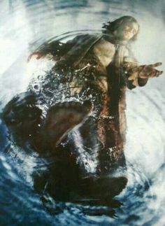 an image of jesus in the water with his arms outstretched