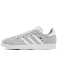 (WMNS) adidas originals Gazelle 'Grey White' IF0917 Gray Gazelle Adidas Outfit, White Suede Adidas Logo Sneakers, Classic Gray Sneakers With Laces, Gray Low-top Sneakers With Gum Sole, White Adidas Suede Skate Shoes, Gray Sports Sneakers With Gum Sole, Adidas White Suede Skate Shoes, Gray Gum Sole Sneakers For Sports, Gray Sneakers With Vulcanized Sole For Light Sports