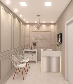 a room with white furniture and lights on the ceiling