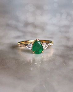 Pear cut Emerald Trilogy ring set in an 18k yellow gold pavé band Diamond Climber Earrings, Blue Sapphire Studs, Aquamarine Studs, Vintage Drop Earrings, Bespoke Rings, Bespoke Engagement Ring, Pave Band, Climber Earrings, Precious Jewels