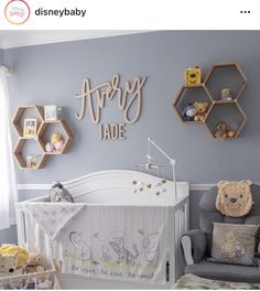 a baby's room with winnie the pooh crib and teddy bear decorations