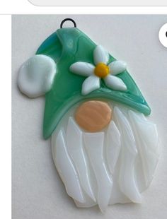 a glass ornament with a flower on it