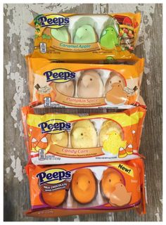 three bags of peeps candy sitting next to each other