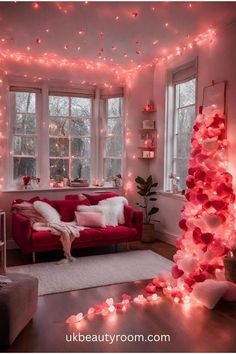 a living room filled with furniture and pink lights hanging from the ceiling over it's windows