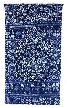 a blue and white rug on a white background