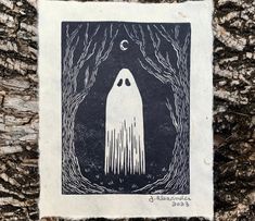 a black and white image of a ghost in the woods with moon above it on a piece of paper