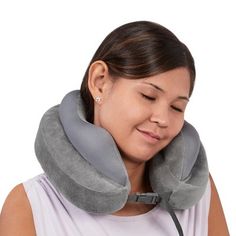 a woman wearing an inflatable neck pillow