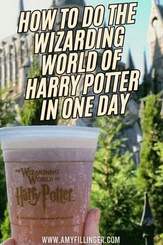 someone is holding up a drink in front of hogwarts castle with the words how to do the wizarding world of harry potter in one day