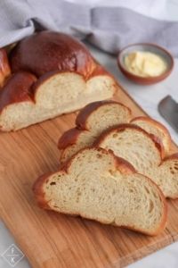 slices of bread sitting on top of a wooden cutting board