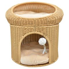 a wicker pet bed with a white flower on top