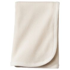 a white blanket folded on top of each other