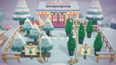 a snowy scene with trees and signs in front of a building that says nick's candy