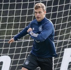 a soccer player in action on the field during a practice session for his team's upcoming game