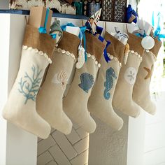 the stockings are hanging from the hooks on the wall