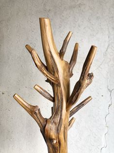 a wooden tree sculpture sitting on top of a table