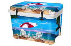 a cooler with two chairs and an umbrella on the beach