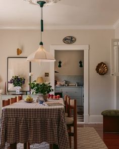 a dining room with a table and chairs