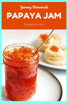 a jar filled with jam sitting on top of a white plate