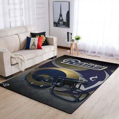 a living room with a couch, chair and rug that has a football helmet on it