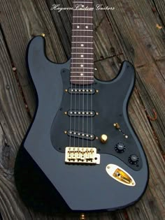 an electric guitar sitting on top of a wooden floor