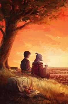 two people sitting under a tree looking at the sunset over a field with an orange sky