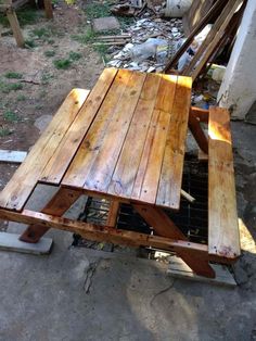 a picnic table made out of wooden boards