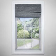 an open window in a room with white walls and grey blinds on the windowsill