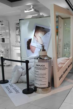 a display in a retail store with an advertisement for sepicoa on the wall