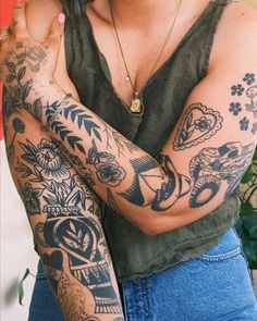 a woman with many tattoos on her arms