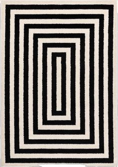 a black and white rug with an interlocked design on the bottom half of it