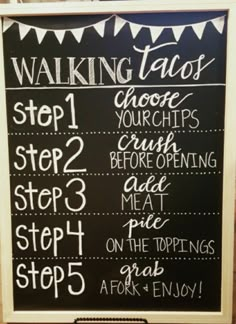 a chalk board with instructions for walking tacos