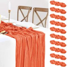 the table is set with orange napkins and place settings