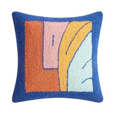 a blue and orange pillow with an abstract design on the front, sitting against a white background