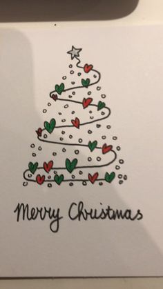 a card with a christmas tree drawn on it