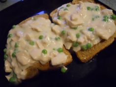 two pieces of bread with green peas on it