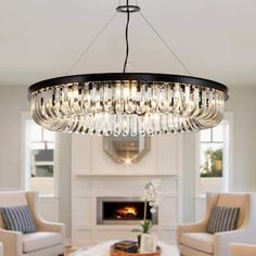 a chandelier hanging from the ceiling in a living room